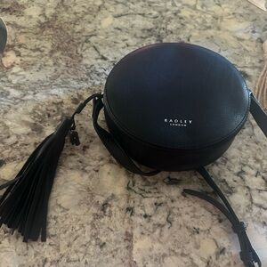 Radley London circular cross body bag with tassle
